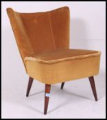 A vintage / retro 1950's cocktail chair - lounge chair in original yellow velour material being