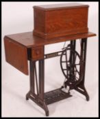 An early 20th century Singer sewing machine table.