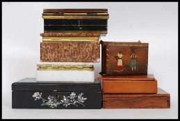 A collection of boxes to include 2 soapstone jewellery trinket boxes,