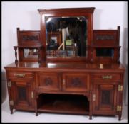An Edwardian mahogany large mirror back sideboard.