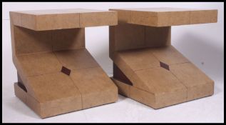 An unusual pair of angled side - lamp tables being tiled effect vinyl covered.