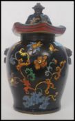 A large lidded StaffordshireChinese style pot,
