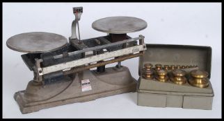 A vintage set of Ohaus Industrial Balance scales along with a case of brass Ohaus weights
