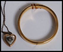 A good quality rolled gold bangle / bracelet with safety chain together with a  gold plated and