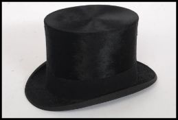 An original vintage gents top hat, within the original box.