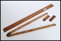 A group of vintage wooden measures /  rules to include Rabone No 1601,
