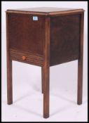 A vintage early to mid 20th century oak workbox, having lift up lid,