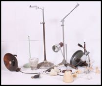 A collection of vintage / retro / industrial lights and light fixtures along with stands please see