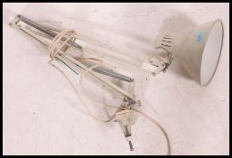A vintage retro industrial machinists  anglepoise desk lamp having attached clamp
