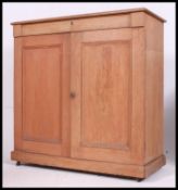 A Victorian pine school cupboard.