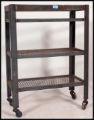 An Industrial 20th century tote trolley having 3 tiers with mesh bases.