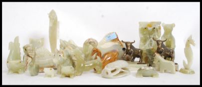 A collection of onyx carved animal  figures to include fish.