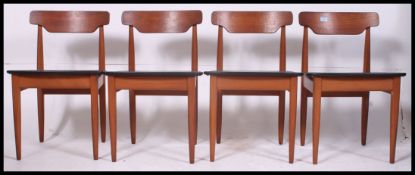 A set of 4 Vintage teak and black leatherette dining chairs by ' Elliot ' of Broadway.