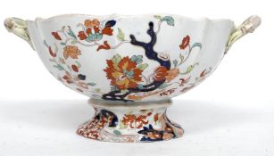 A Mandalay pattern large twin handled raised fruit bowl dish bearing stamp to the underside.