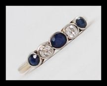 An 18ct gold, platinum sapphire and diamond 5 stone ring.