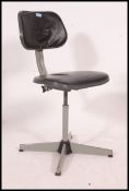 A mid century Industrial metal office swivel chair in grey with vinyl upholstered seat and back