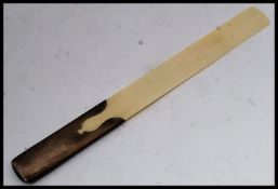 A silver and ivory hallmarked page - paper turner. Silver hallmarked for London 1914 by T. B&CO Ltd.