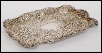 A stunning silver hallmarked for Birmingham rococo dish with floral and foliate repousse decoration