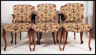 A French 20th century style set of 6 fauteuil dining chairs.