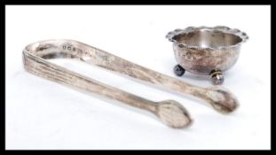 A pair of Georgian 19th century silver hallmarked sugar tongs by Peter, Ann & William Bateman mark,