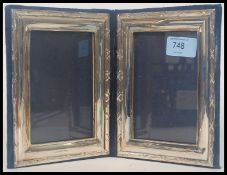 A silver hallmarked 20th century silver mounted desk  picture frame with folding dark blue velvet