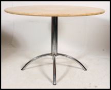 A contemporary retro style marble and chrome dining table.