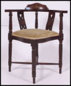 A Victorian  mahogany corner chair with a pair of pierced splats,
