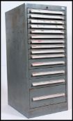 A vintage retro steel cased industrial filing cabinet / tool cabinet, having 14 graduating drawers.