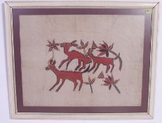 A large framed and glazed batik / screen print on cotton of deers eating foliage