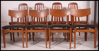 Two sets of retro dining chairs the first set having vinyl seats with wooden back rests and the