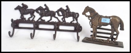 HORSE ITEMS: Two cast metal horse themed racks - one being a coat rack, the other a letter rack.