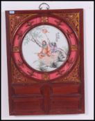 An early 20th century framed Chinese oriental porcelain plaque screen,