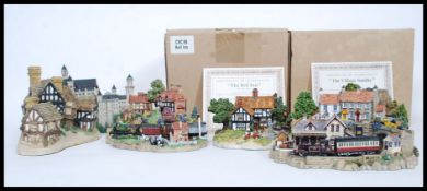 A collection of assorted loose unboxed Lilliput Lane model cottages,
