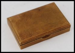 A 1950's rectangular retro vintage Melissa musical compact in gilded metal.