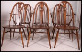 An excellent set of 6  Golden Dawn Ercol refectory dining chairs raised on turned supports united