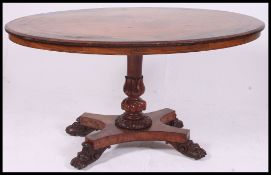 A Victorian walnut oval inlaid breakfast / loo dining table.