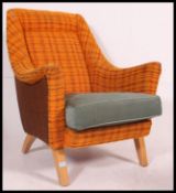 A G&T retro 1950's armchair in the original fabric with makers label.