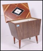 A fantastic retro sewing / work box having a vaneered outer with a lift up lid exposing a fantastic