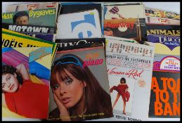 A collecion of Long Play ( lp's ) vinyl records of various genres and artists dating from the