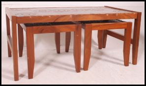 A vintage retro set of tile topped coffee tables,