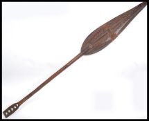 A mid century South Pacific - possibly Fijian tribal hardwood one piece paddle carved with