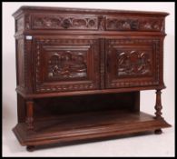 A 19th century Jacobean carved oak green man revival marble top sideboard / buffet.