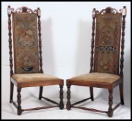 An excellent pair of Carolean design walnut high back chairs.