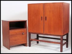 A 1970's Danish influence teak cabinet on stand in the manner of G-Plan.