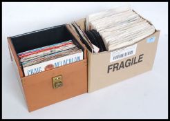 A collection of 45 RPM records, 1980's records and others. Within a carry case.