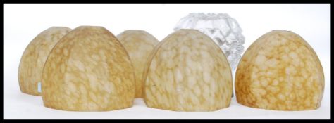 A collection of five matching 1930's mottled glass light shades along with a retro boxed example