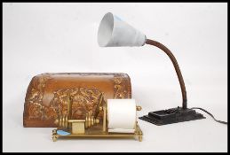 A goose neck mid century anglepoise desk lamp together with a brass desk tidy and a leather