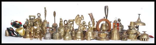 A collection of assorted metalwares, mostly various brass bells,