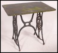 A vintage cast iron Singer Sewing Machine table with a slate top - ideal garden table - cafe / pub