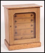 A Victorian pine Wellington type specimin cabinet.
